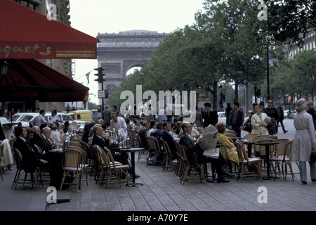 Europe, France, Paris. Champs-Elysees, street cafe and Arc de Triomphe Stock Photo