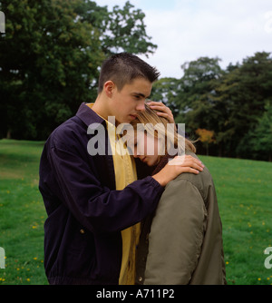 People boy comforting distresed girl posed by models Stock Photo