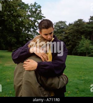 People boy comforting distresed girl posed by models Stock Photo