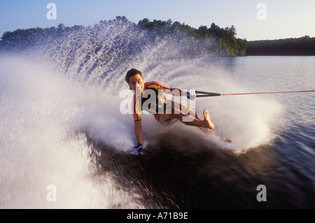Man barefoot waterskiing on one foot North Carolina USA model released image Stock Photo