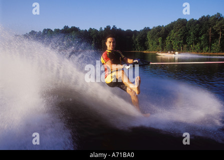 Man barefoot waterskiing on one foot North Carolina USA model released image Stock Photo