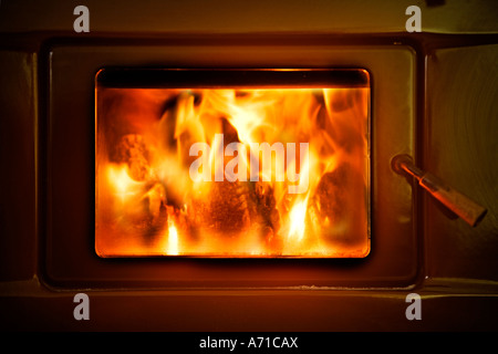 Roaring fire in log burner Stock Photo