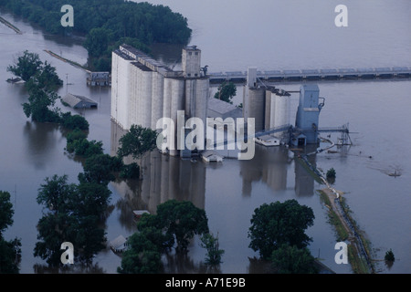 Aerial view of a grain elevator that is surrounded by water due to an overflowing Mississippi River in Meyer IL Stock Photo