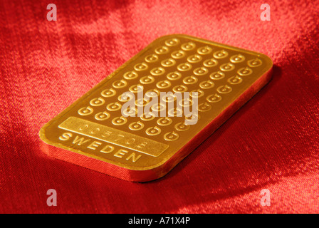 Close up of a 100 grams heavy solid gold bar from Swedish mining company Boliden Stock Photo