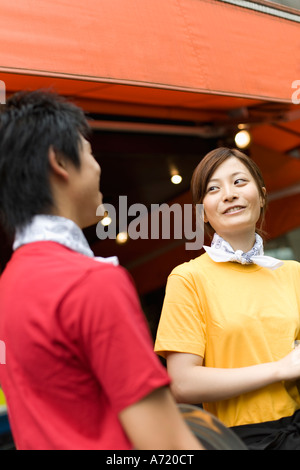 Waiters standing in front of coffee shop Stock Photo