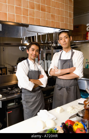 Two chefs standing in restaurant kitchen Stock Photo