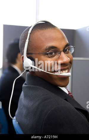 Young man working in call center Stock Photo