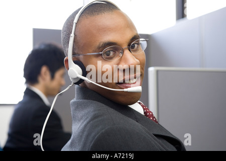 Young man working in call center Stock Photo