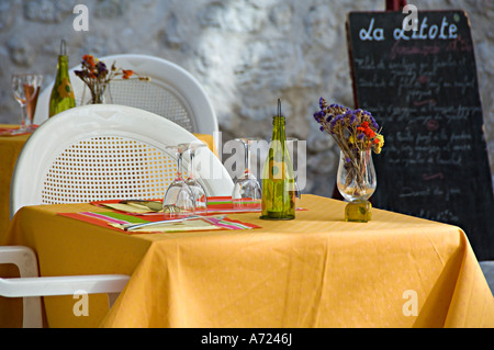 A colourful table setting at an outdoor cafe in the south of France Stock Photo