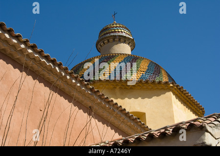 Colourful ceramic tiles cover the dome of an old church in Vence, near Nice, France Stock Photo