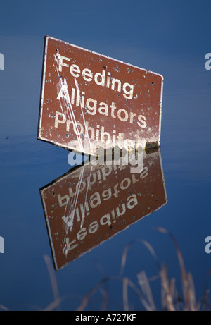 Predators Cation Sign A warning sign at St. Marks National Wildlife Refuge reminds visitors ...