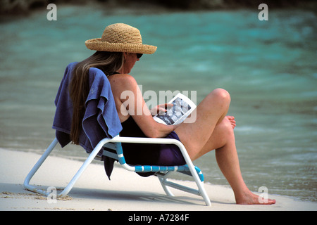 Bermuda, Woman reading on the beach Stock Photo