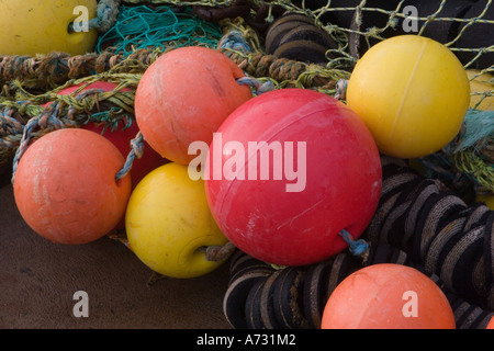 Fishing nets, bouys and floats on dockside at Banff, North East Scotland. Stock Photo