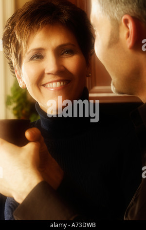 Man and woman conversing over coffee Stock Photo