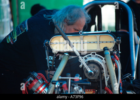 crew member working on top methaol funny car drag car Stock Photo