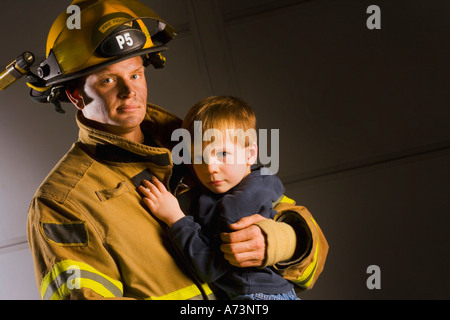 firefighter carrying baby