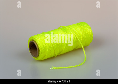 Download A Reel Of Yellow String Against An Off White Background Vertical Stock Photo Alamy Yellowimages Mockups