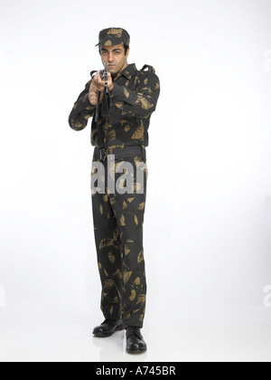 Indian Army Soldier Standing And Pointing Ak-47 Gun Stock Photo - Alamy