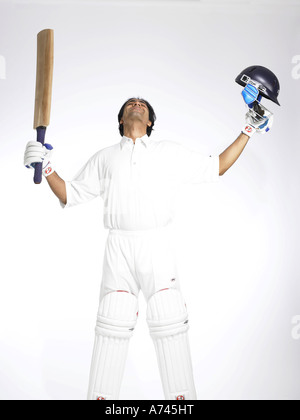 VDA 201777 Indian batsman looking up in the sky to thank god for good score in cricket match MR 702A Stock Photo