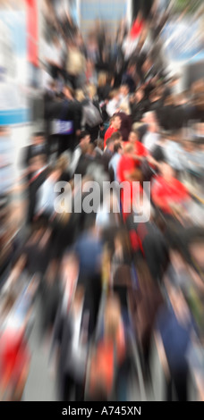 looking down busy aisle of trade show Stock Photo