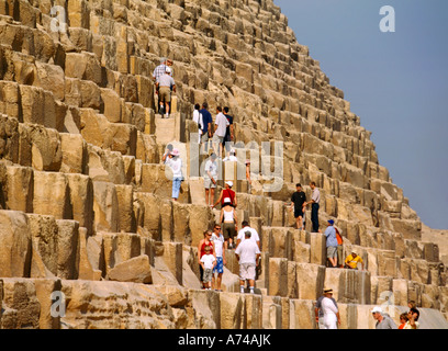 Tourists on Cheops Pyramid Egypt Stock Photo