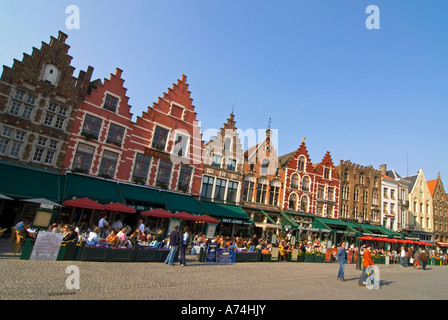 Horizontal view of the spectacular traditional gabled buildings surrounding the Markt [Market Place] on a bright sunny day in Bruges. Stock Photo