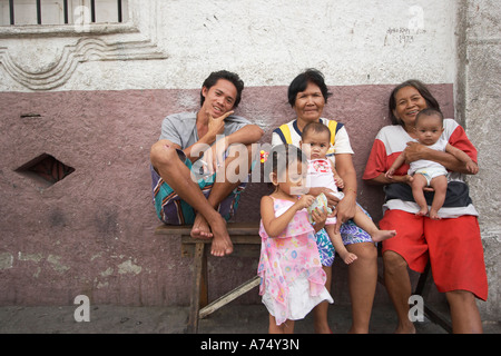 Generations Sitting Outside House In Intramuros Stock Photo
