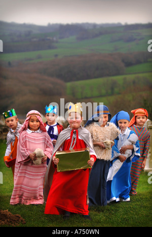 CHILDREN IN COSTUME BEFORE A PRIMARY SCHOOL NATIVITY PLAY IN A CHURCH DORSET UK Stock Photo