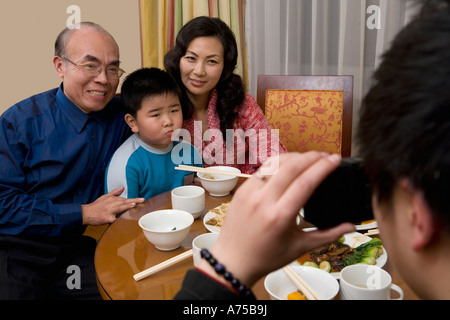 Middle-aged couple and grandson posing for picture Stock Photo