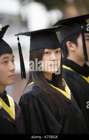 side view of chinese girl with cap walking Stock Photo - Alamy