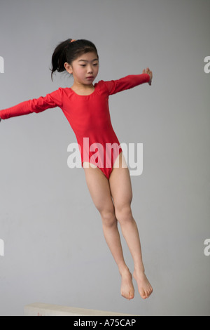 Young girl practicing gymnastics Stock Photo