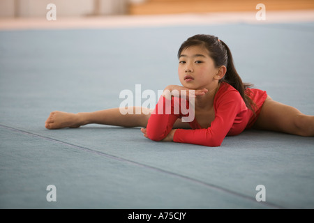 Young girl practicing gymnastics Stock Photo