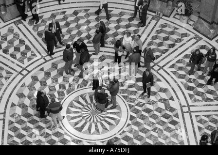 Visitors and lawmakers at the Hartford State Capitol Building in Connecticut with marble floor pattern Stock Photo