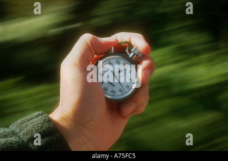 Hand operating a stopwatch Stock Photo