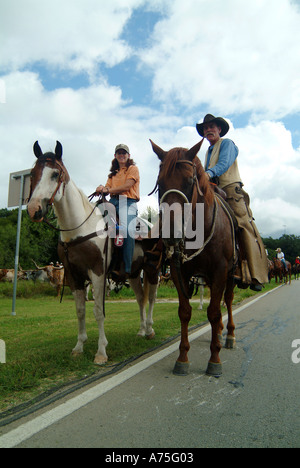A couple of cowboys riding horses in Bandera Texas Stock Photo