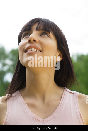Young woman looking up, portrait Stock Photo