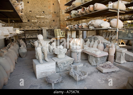 Pompeii, Campania, Italy; artifacts recovered during excavation including a cast of a human body. Stock Photo