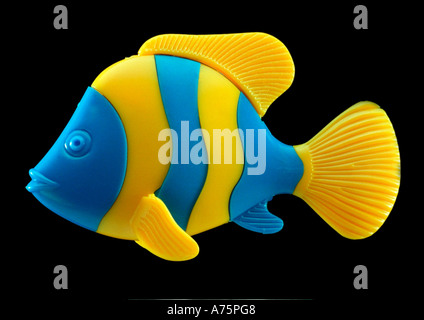 Plastic yellow and blue toy fish Stock Photo - Alamy