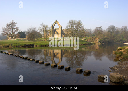 Stepping stones over the river Wharfe next to Bolton Abbey in the Yorkshire Dales. England. Stock Photo