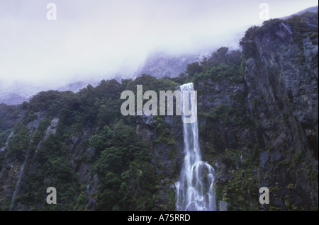 Temporary Waterfall during rain storm Milford Sound Fiordland National Park South Island New Zealand Stock Photo