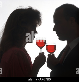 couple toasting with drinks at party Stock Photo
