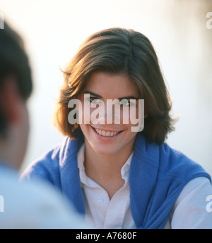 young couple talking outdoors Stock Photo