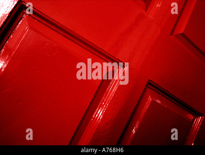 Red panelled wooden door Stock Photo