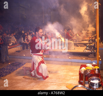 Hindu priests performing the Deepmala Ceremony at a Ghat on the banks of the river Ganges in Varanasi India Stock Photo