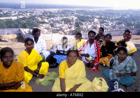 An Indian family having a picnic and enjoying the view from the summit of the Rock Fort over Tiruchirapalli Tamil Nadu India Stock Photo