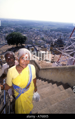 Hindu lady and gentleman on the last steps to the summit of the Rock Fort Tamil Nadu India Stock Photo