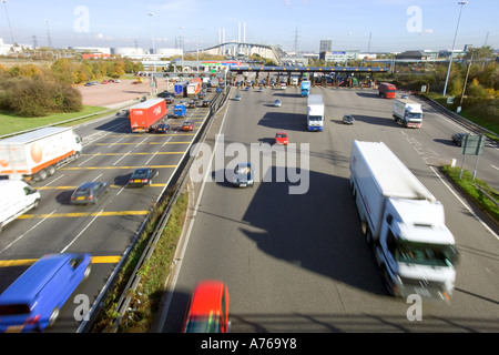 A wide view of traffic at the tolls of the QE2 bridge on the M25 motorway with slow shutter speed for motion blur. Stock Photo