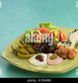 Greek starters, feta cheese, taramas, tsatsiki and pickled vegetables Stock Photo