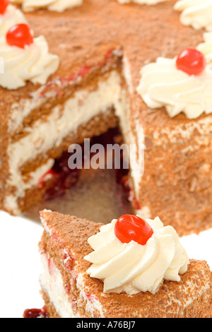 Close up on a gateau with one slice cut out on a pure white background. Stock Photo