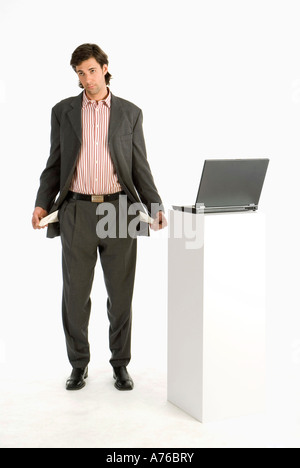 Businessman showing empty pockets Stock Photo